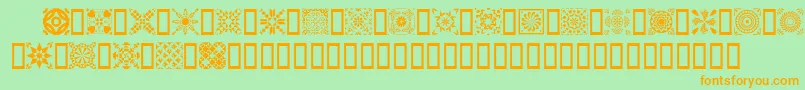 フォントQuild – オレンジの文字が緑の背景にあります。