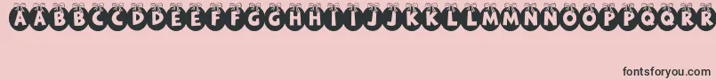 RyTha-Schriftart – Schwarze Schriften auf rosa Hintergrund