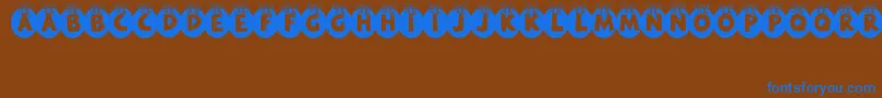 RyTha Font – Blue Fonts on Brown Background