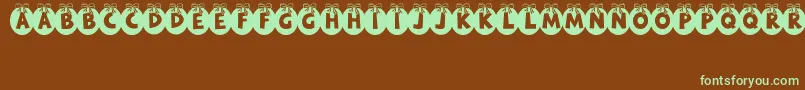 Czcionka RyTha – zielone czcionki na brązowym tle