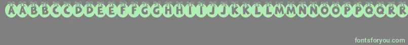 RyTha Font – Green Fonts on Gray Background