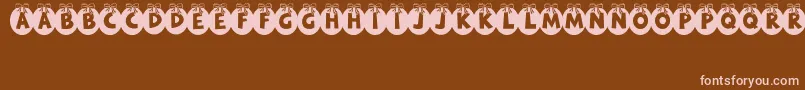 RyTha Font – Pink Fonts on Brown Background
