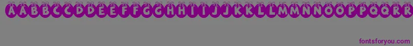 フォントRyTha – 紫色のフォント、灰色の背景