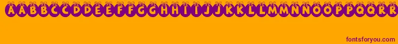 Czcionka RyTha – fioletowe czcionki na pomarańczowym tle