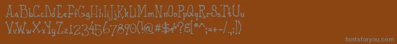 Czcionka PhaetonJohn – szare czcionki na brązowym tle