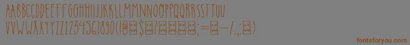 フォントDkInsomniac – 茶色の文字が灰色の背景にあります。