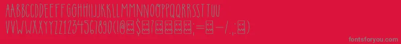 DkInsomniac-Schriftart – Graue Schriften auf rotem Hintergrund