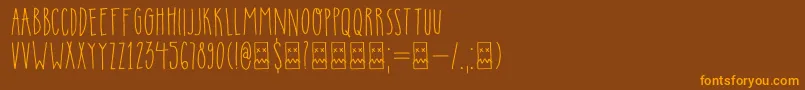 DkInsomniac-Schriftart – Orangefarbene Schriften auf braunem Hintergrund