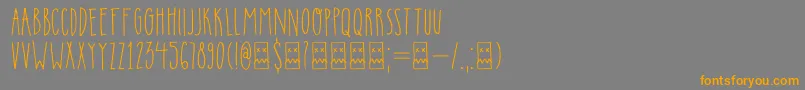 フォントDkInsomniac – オレンジの文字は灰色の背景にあります。
