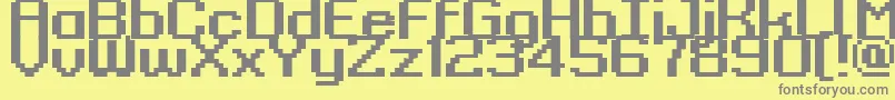 フォントKyrou9RegularBold – 黄色の背景に灰色の文字