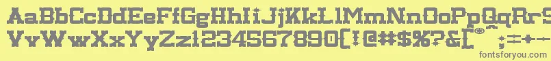 フォントLassiterExtended – 黄色の背景に灰色の文字