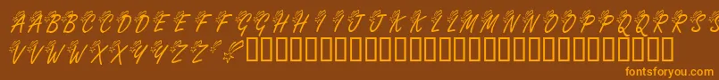 KrShootingStarLeft-Schriftart – Orangefarbene Schriften auf braunem Hintergrund