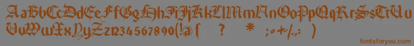 フォントRememberreinerfs – 茶色の文字が灰色の背景にあります。