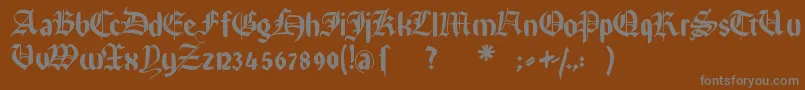 Rememberreinerfs-fontti – harmaat kirjasimet ruskealla taustalla