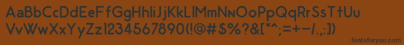 OdinRoundedRegular-Schriftart – Schwarze Schriften auf braunem Hintergrund