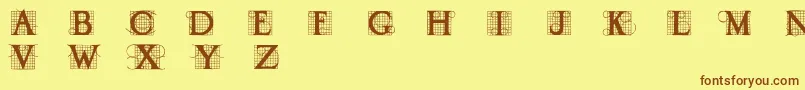 フォントDraud – 茶色の文字が黄色の背景にあります。