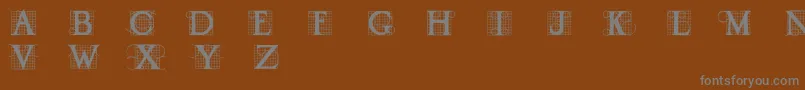 Draud-fontti – harmaat kirjasimet ruskealla taustalla