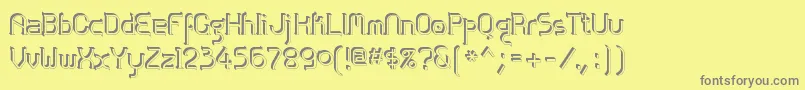 フォントZolofse – 黄色の背景に灰色の文字