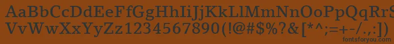 LinoLetterLtMedium-fontti – mustat fontit ruskealla taustalla
