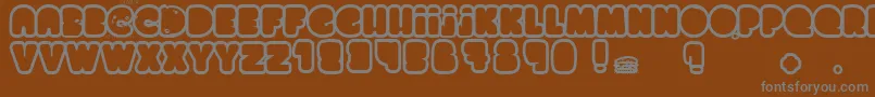 ChocolateCake-fontti – harmaat kirjasimet ruskealla taustalla