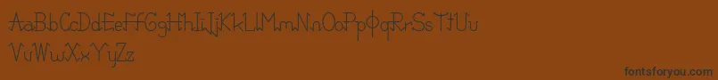 PixoDemo-fontti – mustat fontit ruskealla taustalla