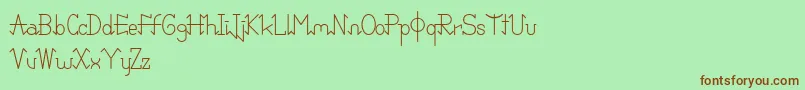 PixoDemo-Schriftart – Braune Schriften auf grünem Hintergrund