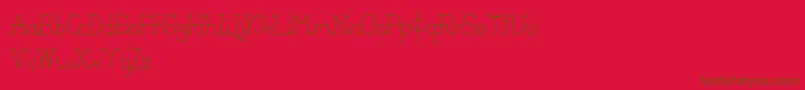 Czcionka PixoDemo – brązowe czcionki na czerwonym tle