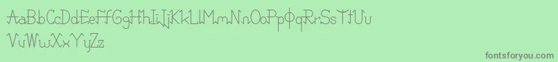PixoDemo-fontti – harmaat kirjasimet vihreällä taustalla