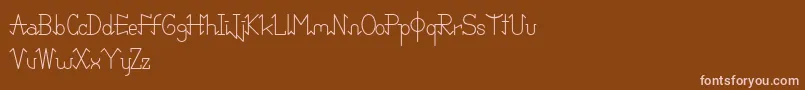 PixoDemo-fontti – vaaleanpunaiset fontit ruskealla taustalla