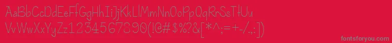 Rolande-Schriftart – Graue Schriften auf rotem Hintergrund