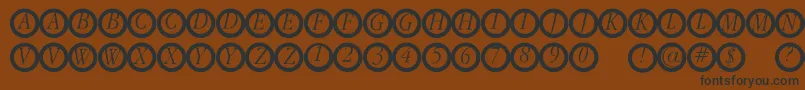 Garanitialrings Font – Black Fonts on Brown Background