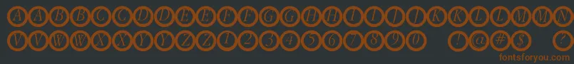 Garanitialrings Font – Brown Fonts on Black Background