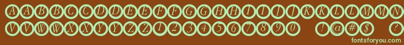 Garanitialrings-fontti – vihreät fontit ruskealla taustalla
