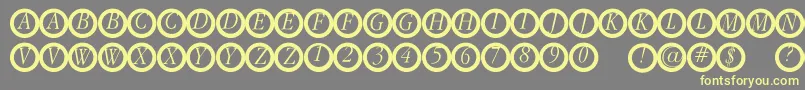 フォントGaranitialrings – 黄色のフォント、灰色の背景