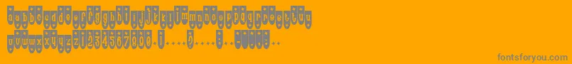 Poptr-fontti – harmaat kirjasimet oranssilla taustalla