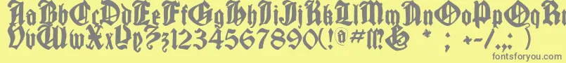 フォントCantaragotica – 黄色の背景に灰色の文字