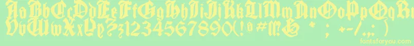 フォントCantaragotica – 黄色の文字が緑の背景にあります
