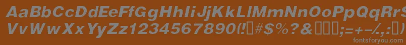 VivassskItalic-fontti – harmaat kirjasimet ruskealla taustalla