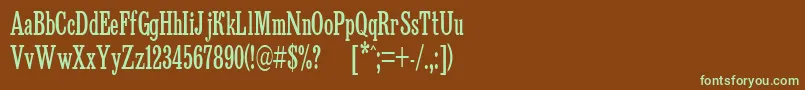 フォントBruskovaya65n – 緑色の文字が茶色の背景にあります。