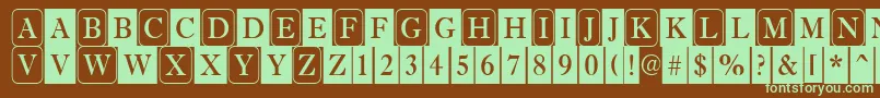 フォントAntiqu6 – 緑色の文字が茶色の背景にあります。