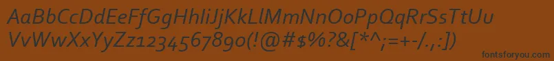 フォントCorbelItalic – 黒い文字が茶色の背景にあります