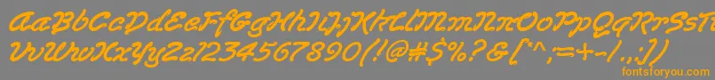 フォントLasvegasd – オレンジの文字は灰色の背景にあります。