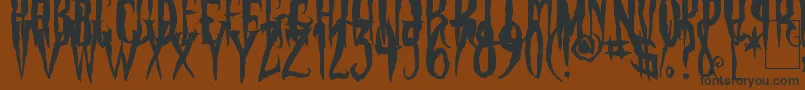 fuente PhantomFingers – Fuentes Negras Sobre Fondo Marrón
