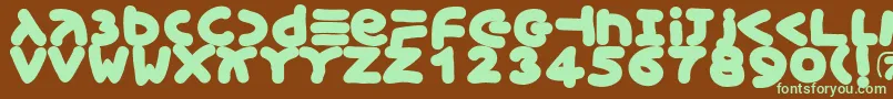 Xmasgingerbread-Schriftart – Grüne Schriften auf braunem Hintergrund