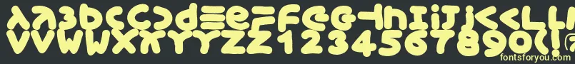 Xmasgingerbread Font – Yellow Fonts on Black Background