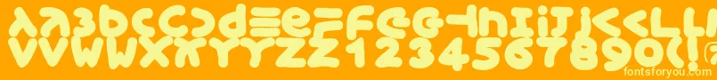 Czcionka Xmasgingerbread – żółte czcionki na pomarańczowym tle