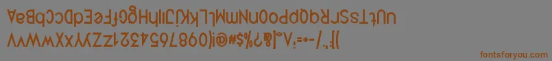 フォントQuirkusUpsideDown – 茶色の文字が灰色の背景にあります。