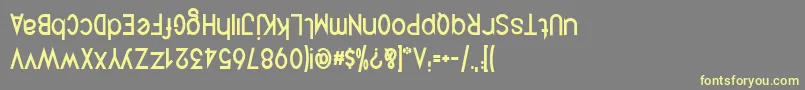 フォントQuirkusUpsideDown – 黄色のフォント、灰色の背景