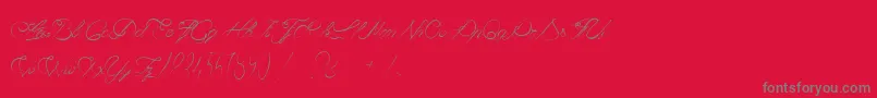 CaviarDeDiane-fontti – harmaat kirjasimet punaisella taustalla