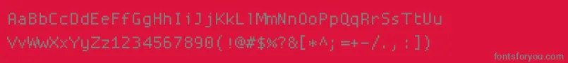 Proggysquarett-fontti – harmaat kirjasimet punaisella taustalla
